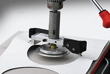 cut circle patches in roofing membrane